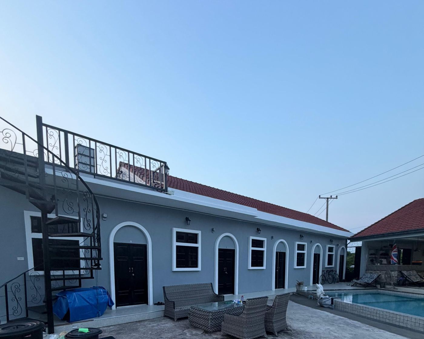 The row of guest rooms at the camp with arched doorways